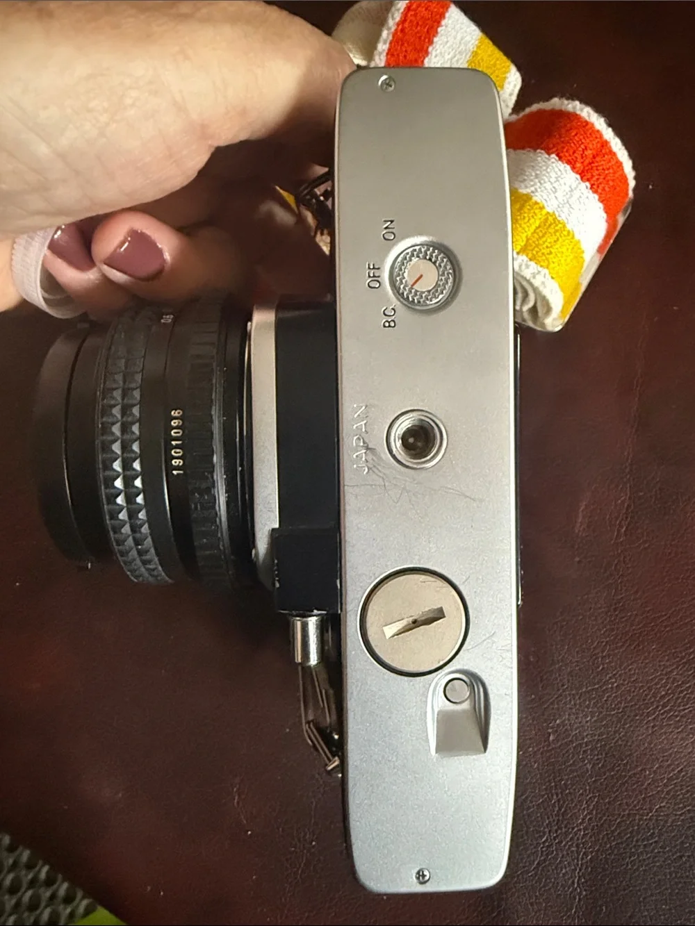 Minolta SR-T 201 35mm Film Camera in Silver and Black with Retro Stripe Strap